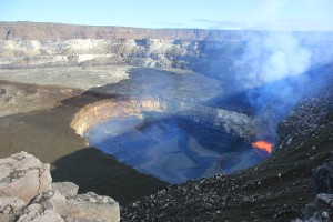 In this photo of Kīlauea Volcano's summit lava lake, the light-colored rock in the vent wall to the left of the spattering lava shows were the rockfall occurred on January 2. HVO image.