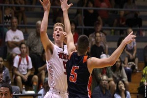 Parker Farris goes up for a shot over Fresno Pacific's Spencer Krannitz on Monday. UH--Hilo photo.