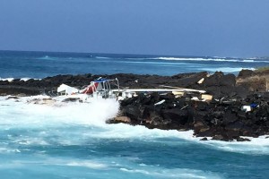 This catamaran, called the Sea Paradise, crashed in this location of Honokohau Harbor on Thursday evening. Photo credit: Marcy Anderson.