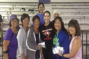 UH-Hilo tennis coach Tina McDermott (center), surrounded by members of the East Hawai'i District Tennis Assocition. UH-Hilo photo.