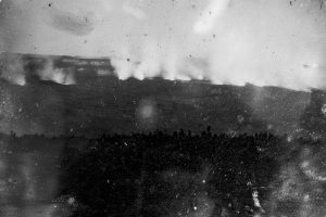 This daguerreotype image, captured in 1855 by Hugo Stangenwald, is the earliest known photograph of Kīlauea Volcano. Although scratched and faded, the 161-year-old photo shows a line of steaming vents across the floor of Kīlauea’s summit caldera as viewed from a location near today’s Volcano House Hotel. The caldera rim is visible in the lower third of the image. Photo courtesy of Hawaiian Mission Houses Historic Site and Archives.