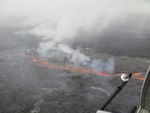 On May 25, the northern breakout on Puʻu ʻŌʻō was feeding an impressive channel of lava that extended about 950 m (0.6 mi) northwest of the cone. This channel was about 10 m (32 ft) wide as of 8:30 a.m. USGS/HVO photo.