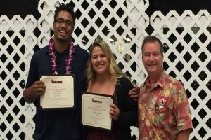 Salim Gloyd (left) and Bailey Gaspar earned the top Athlete of the Year awards at the Vulcan Awards Banquet. Director of Athletics Pat Guillen (right) presented the awards. UH-Hilo photo.