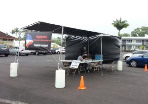 The Hilo drive-thru voter registration site in the northwest corner of the parking lot of the former Hilo Motors in 2014. File photo by Dave Smith.