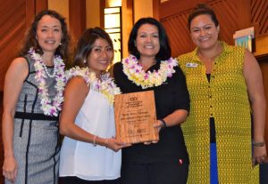 TMT was recognized last week by the Kona Kohala Chamber of Commerce for its community education work on Hawai‘i Island. (Left to right) Dale Suezaki, KKCC Board Chair; TMT staffers Ashley Tanabe, Virginia Aragon-Barnes; and Kirstin Kahaloa, KKCC Executive Director. 