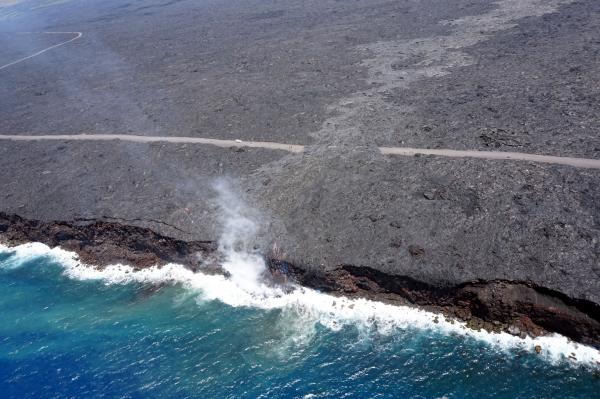 Just over two months since the start of the 61g flow, it reached the ocean on July 26 at 1:15 am HST. The narrow ocean entry was creating a small plume of gas and steam during today's overflight as the lava came into contact with the ocean. USGS photo.