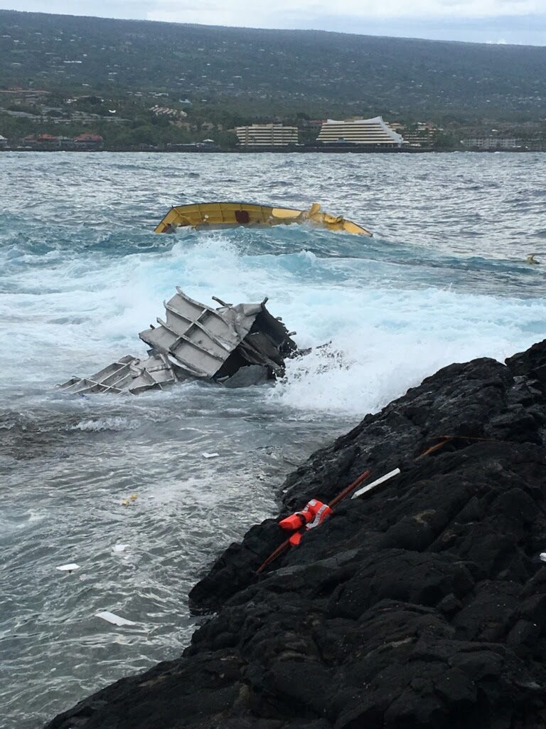 "Spirit of Kona" grounded on rocks during Tropical Storm Darby. US Coast Guard photo.