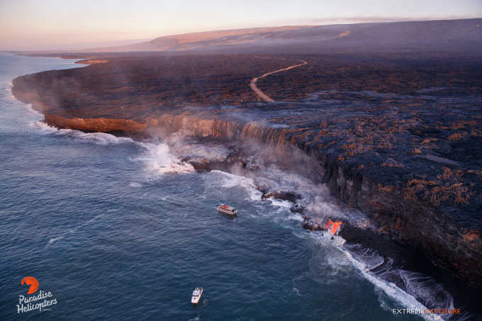 3 The western end of the ocean entry was quite active, with multiple rivers of lava falling over the cliff, adding to the new delta at its base. Photo: Paradise Helicopters flyover, Thursday, Aug. 18.