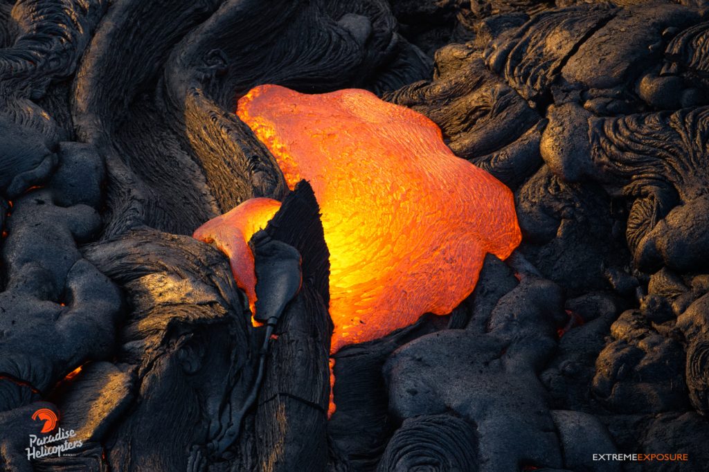 5 Pressure from within ruptures the crust of a tube, releasing molten pahoehoe. Hawaiian Helicopters, Aug. 25, 2016.