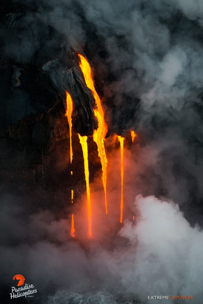 6 Fingers of lava drip into the sea at Kamokuna, creating a steamy, surreal scene. Hawaiian Helicopters, Aug. 25, 2016.