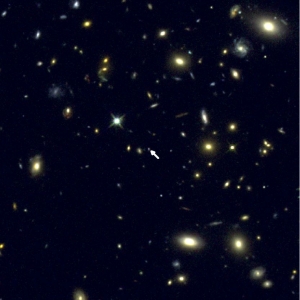 UCLA astronomers use Keck Observatory to look back 12 billion years and measure oxygen. Galaxy COSMOS-1908 is in the center of this Hubble Space Telescope image, indicated by the arrow. Nearly everything in the image is a galaxy. CREDIT: RYAN SANDERS AND THE CANDELS TEAM