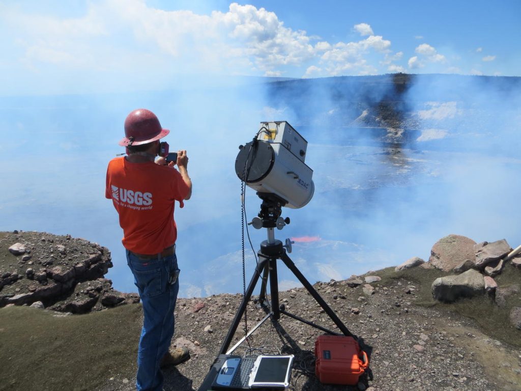 USGS Hawaiian Volcano Observatory geochemist measuring gases released from Kïlauea with a Fourier transform infrared (FTIR) spectrometer, an instrument that detects gas compositions on the basis of absorbed infrared light. Photo: Janet Babb, US Geological Survey, Hawaiian Volcano Observatory