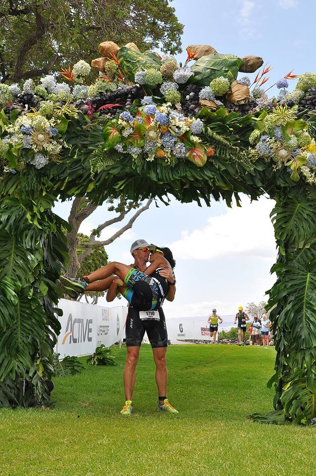James Resor carrying his bride, Sarah, across the Honu finish line this past year. Courtesy photo.