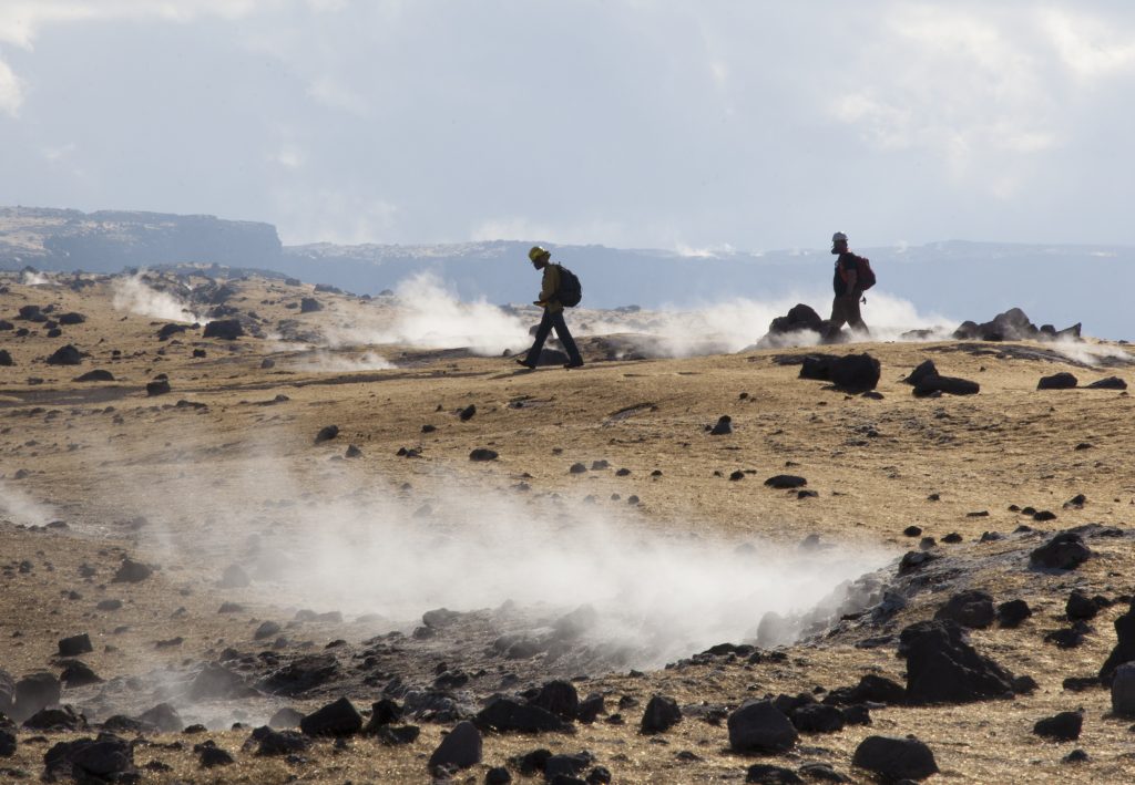 After completing their work on the rim of Halemaʻumaʻu Crater, Hawaiian Volcano Observatory scientists try to stay on pathways to avoid making footsteps in the Pele’s hair that blankets the landscape, just as one shies from marring pristine snow. This area has been closed since 2008 due to elevated sulfur dioxide emissions and other ongoing volcanic hazards associated with Kīlauea’s summit lava lake. USGS photo.