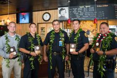 Major Mitchell Kanehailua congratulates West Hawaiʻi Officers Adam Roberg, Kimo Keliipaakaua, Chandler Nacino and Severo Ines.
