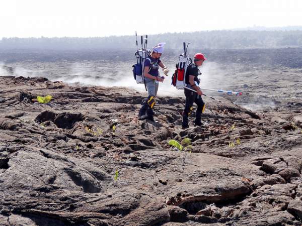 Simulation astronauts Darlene Lim and Rick Elphic, scientists with the NASA Ames Research Center, walk on Mauna Ulu. Photo courtesy of NASA 