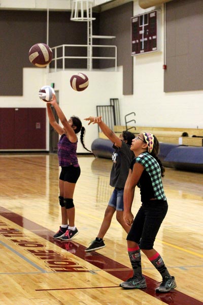Girls participate in passing drills at the HI-PAL Youth Volleyball Clinic. Courtesy photo.