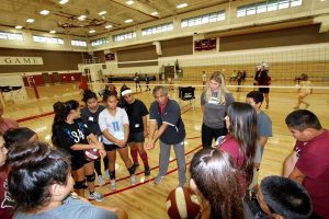 UH-Hilo Vulcan Coach Tino Reyes demonstrates "bump" form at the HI-PAL Youth Volleyball Clinic. Courtesy photo.