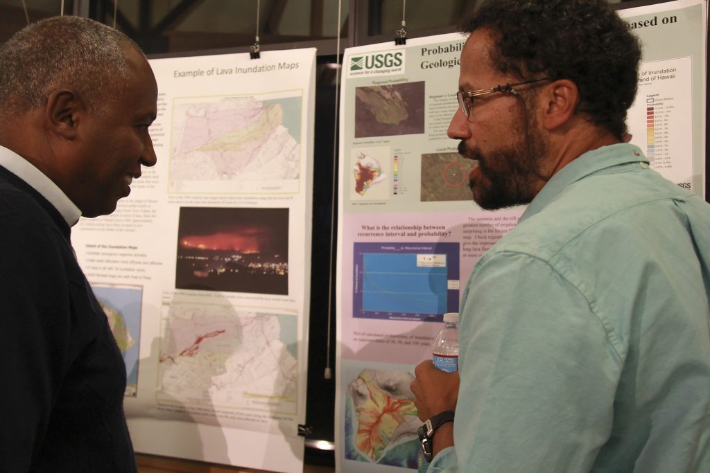 USGS Hawaiian Volcano Observatory geologist Frank Trusdell (right) discusses methodologies for lava flow hazard assessment in Hawaii with a volcanology colleague from Ethiopia during the recent Volcano Observatory Best Practices Workshop in Vancouver, Washington. Eruptions in the East African Rift bear some broad similarities to Hawaiian volcano rift zone eruptions. USGS photo.